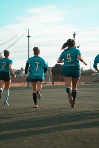 female athletes warming up before a soccer match